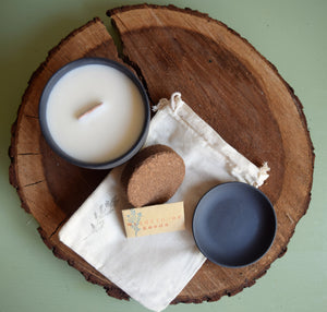 Soy wax candle with coconut coir dirt puck, wildflower seeds, plant tray, and a canvas bag. Candle jar becomes a flower pot once it is done burning.